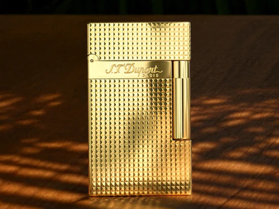 Golden lighter with textured design